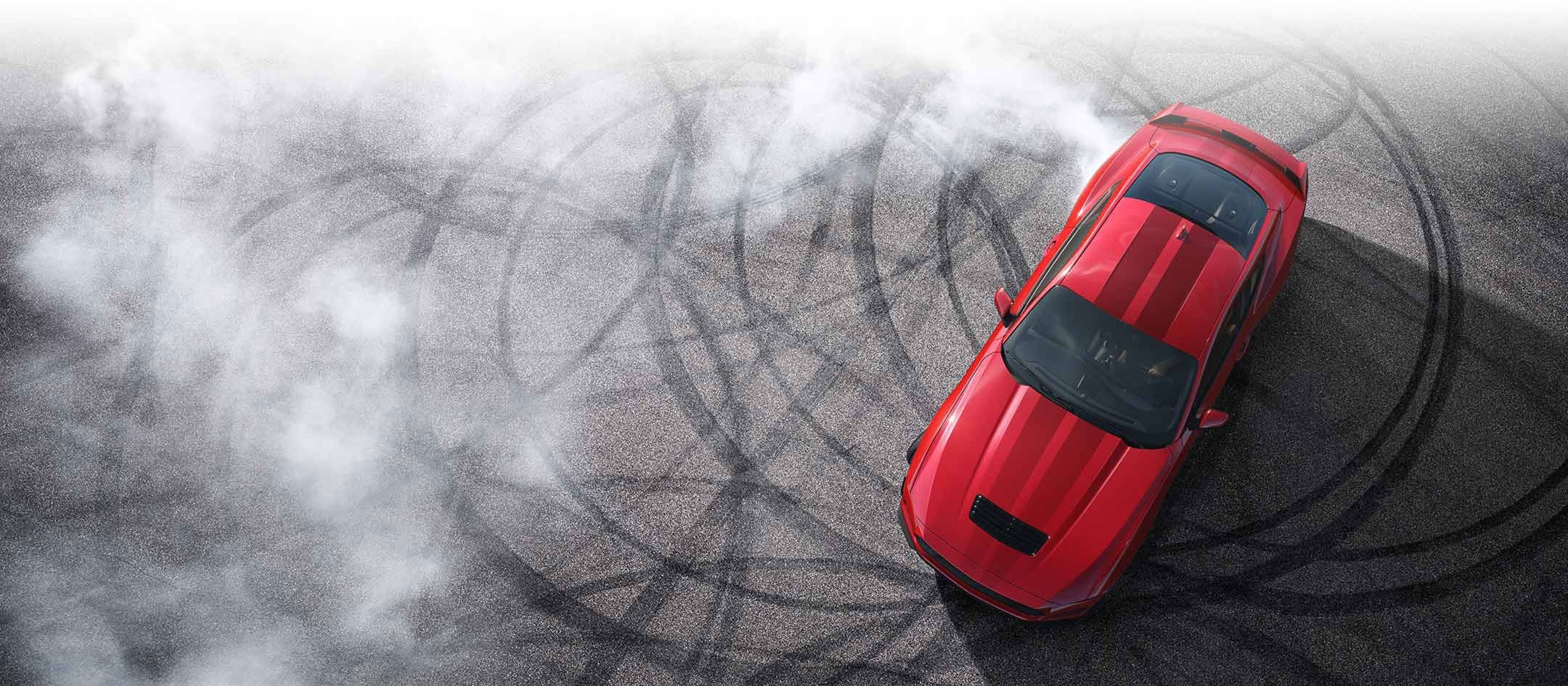 Overhead view of a 2024 Ford Mustang® model with tire tracks on pavement | Summerville Ford in Summerville SC