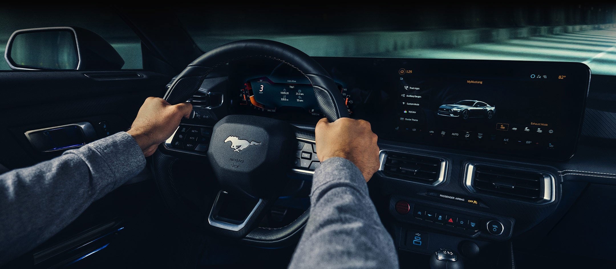 A 2024 Ford Mustang® model interior with a person driving | Summerville Ford in Summerville SC