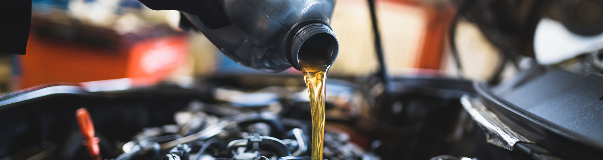 A close-up of an oil change service being performed.